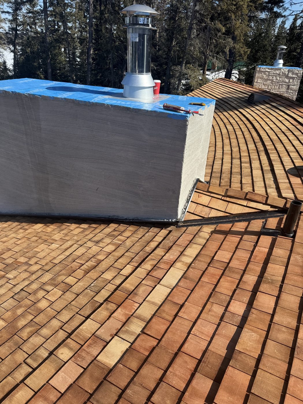 Sweeping cedar shingle roof field