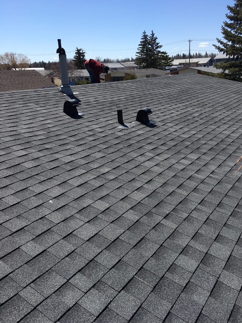 Grey shingle roof re-roof on a Westman home