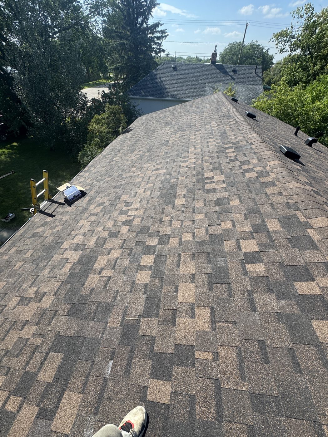 Newly installed architectural asphalt shingle roof on a Westman home