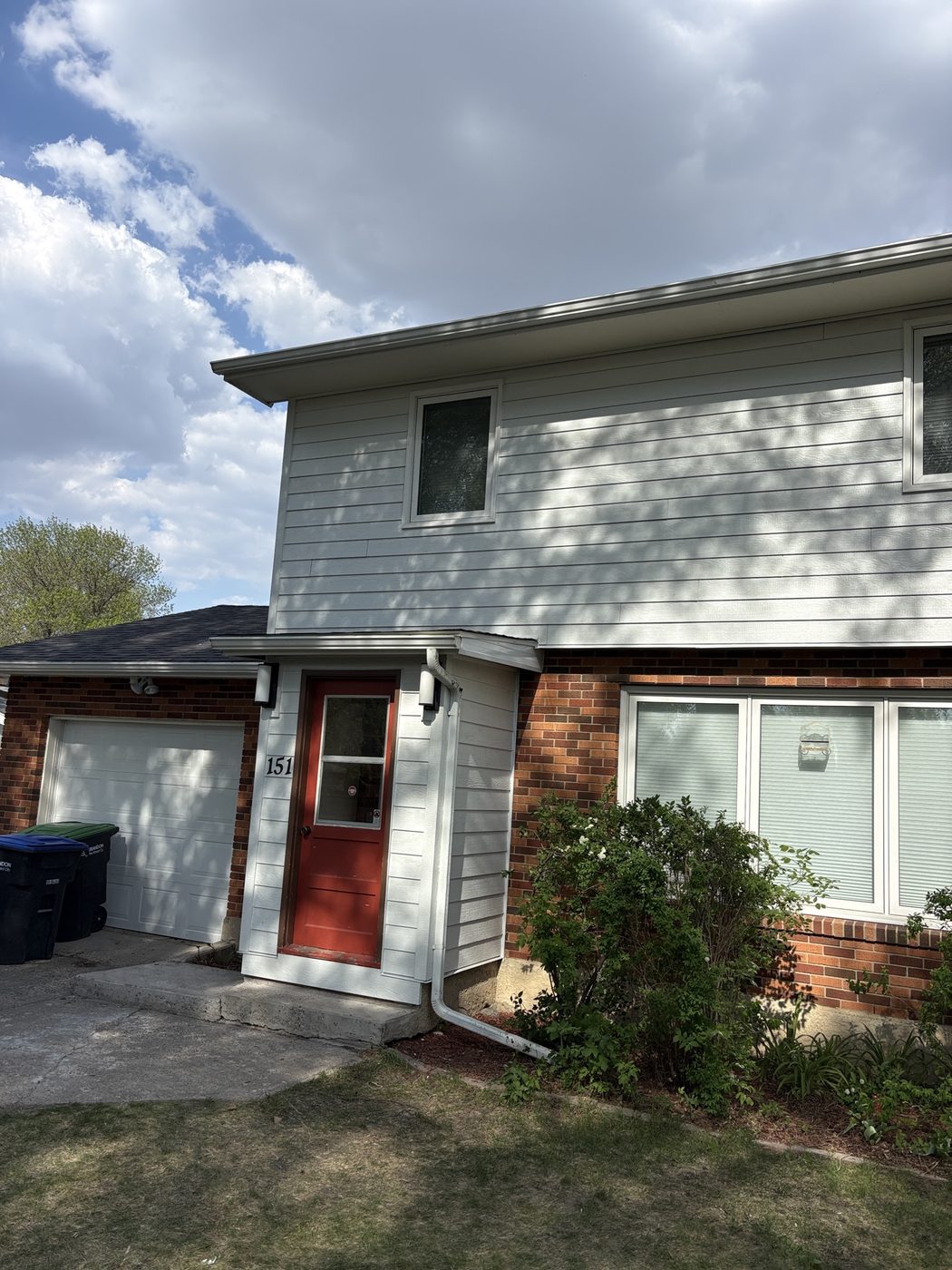 LP-style siding with brick accents